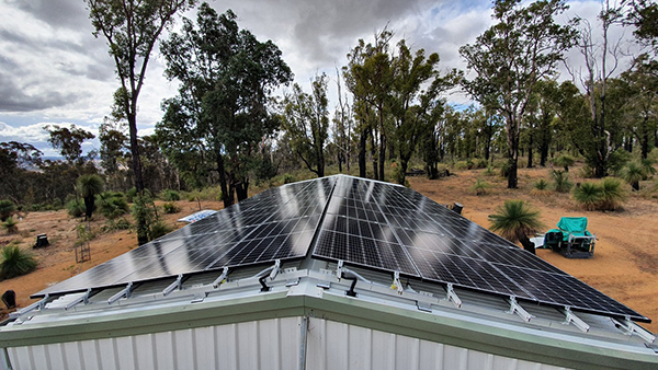 Installing PV array on workshop in Quindanning