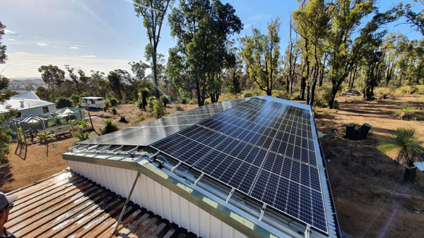 Installing PV array on workshop in Quindanning